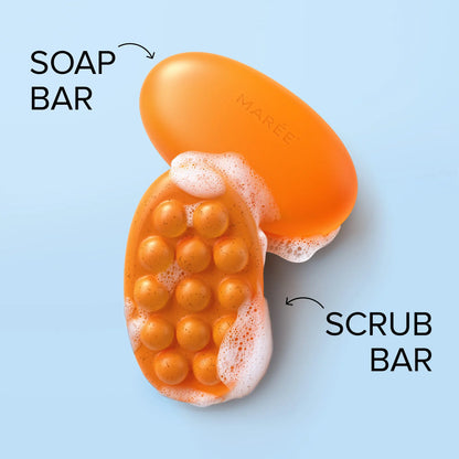 Orange soap bar with bubbles labeled 'Soap Bar' and scrub bar labeled 'Scrub Bar' on a light blue background