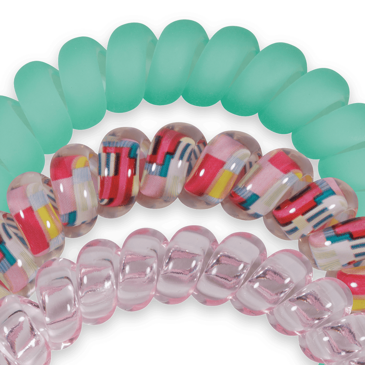 Colorful spiral hair ties on a green background