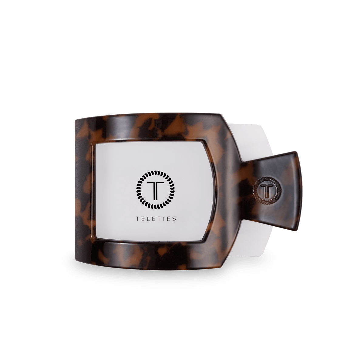 Tortoiseshell-patterned product with 'Teleties' branding on a white background