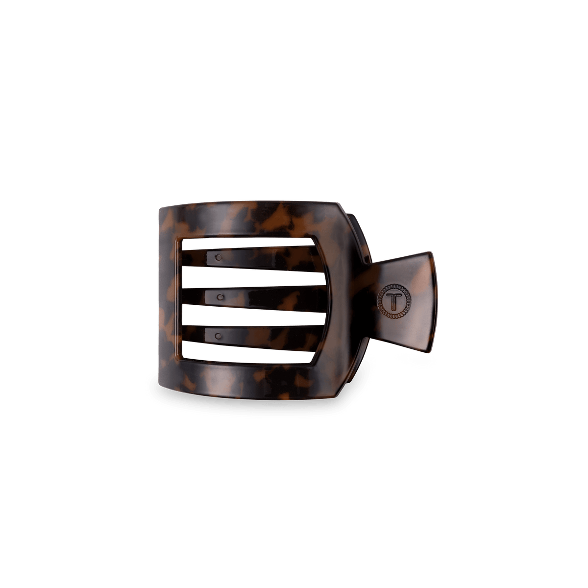 A wide, open-front hair claw clip in a dark brown and black tortoiseshell pattern, shown against a solid dark green background.