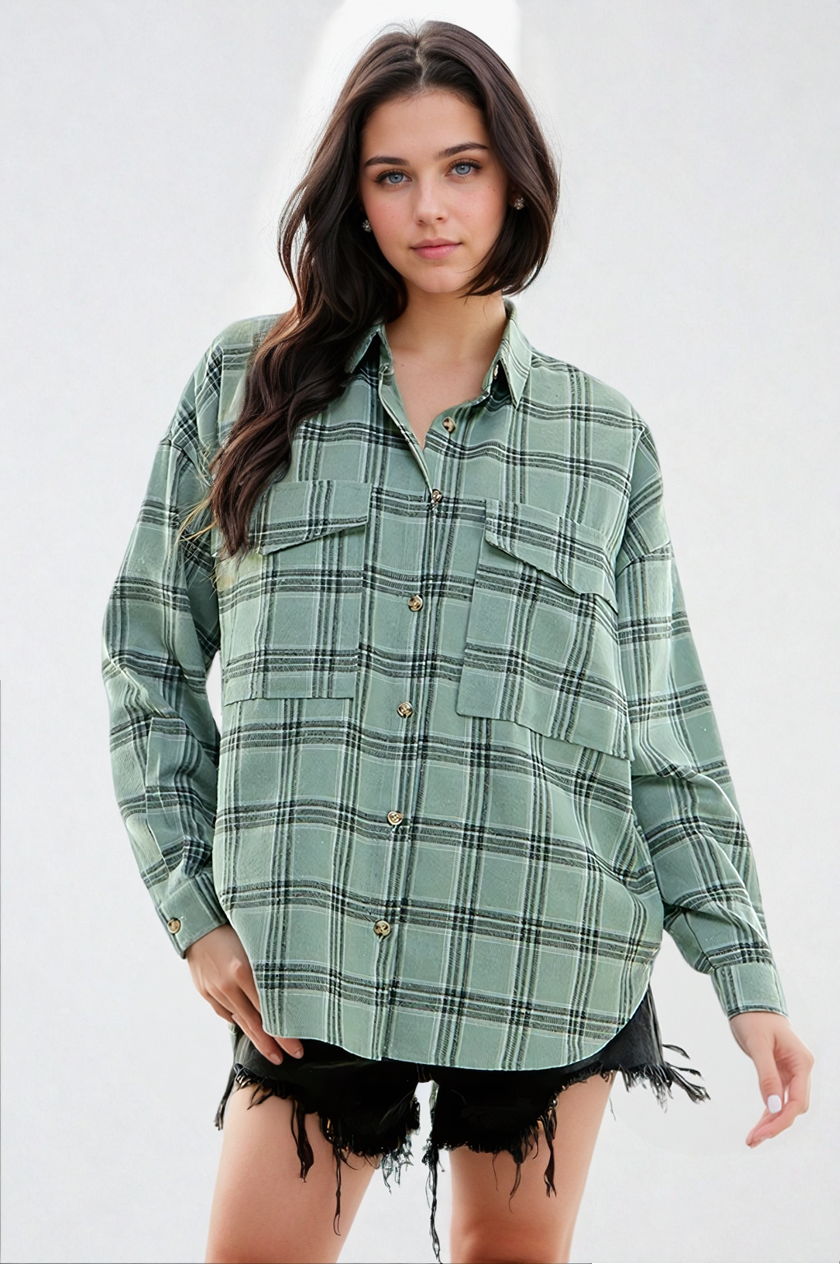 Woman wearing a green plaid shirt on a white background