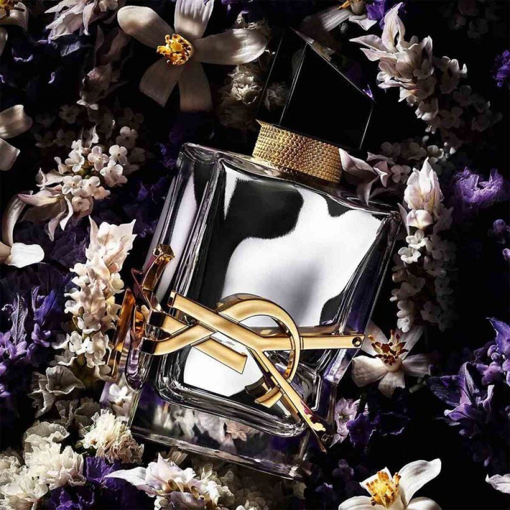 Yves Saint Laurent Libre L'Absolu Platine Parfum bottle surrounded by flowers