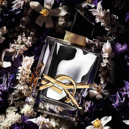 Yves Saint Laurent Libre L'Absolu Platine Parfum bottle surrounded by flowers