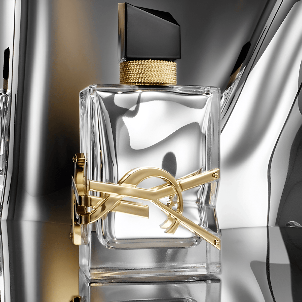 Yves Saint Laurent Libre L'Absolu Platine Parfum bottle on a reflective surface